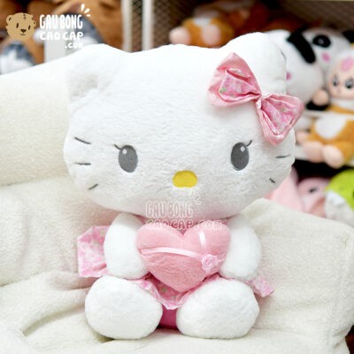 Gấu Bông Hello Kitty đầm hoa ôm tim với chi tiết nơ đỏ đáng yêu